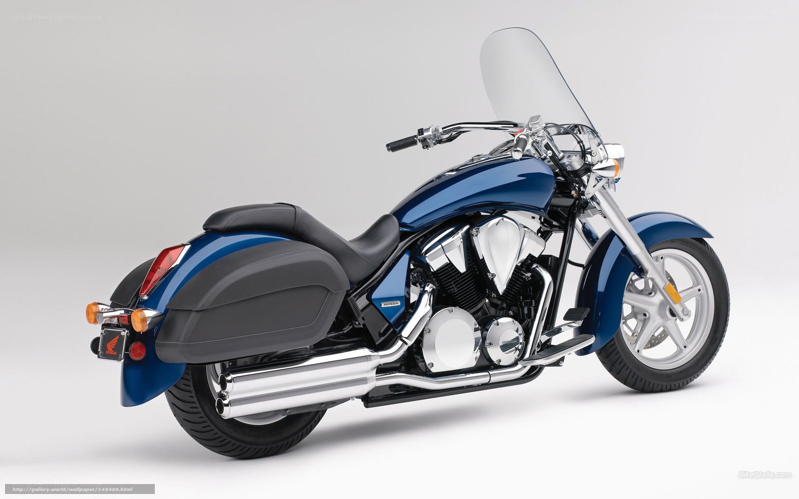 Blue Honda motorcycle with luggage