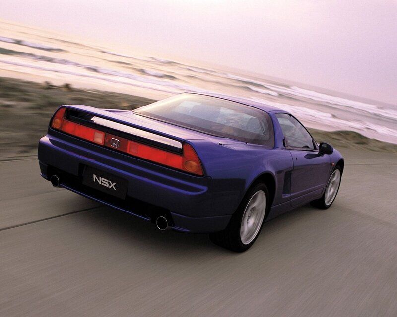 Blue Honda NSX on coastal road