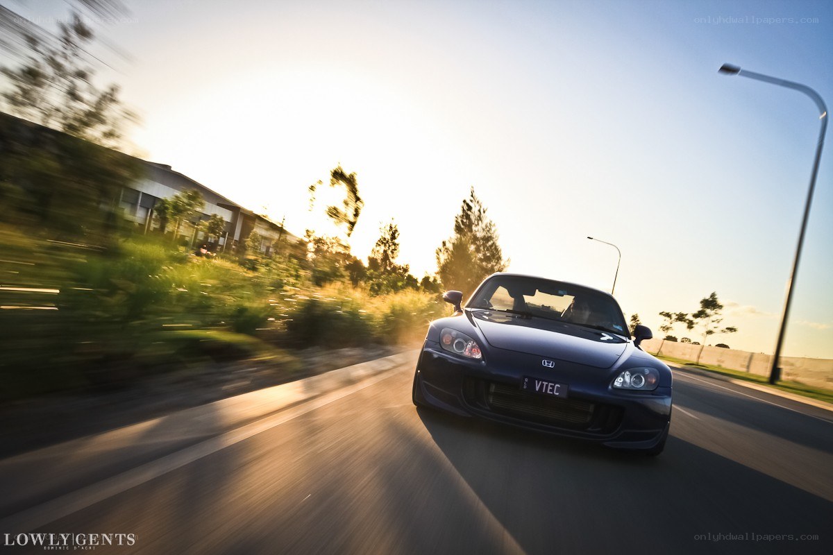 Blue Honda S2000 in motion