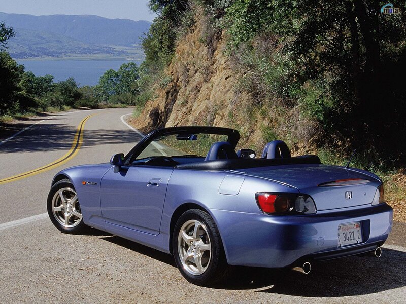 Blue Honda S2000 on a coastal road