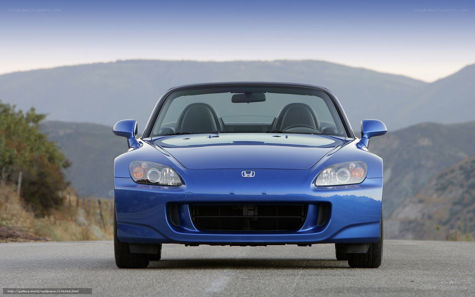Blue Honda S2000 on mountain road