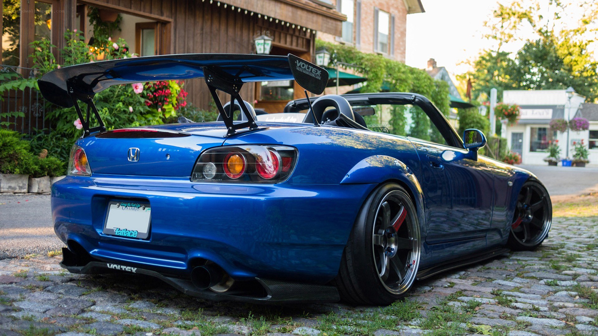 blue honda s2000 with rear wing