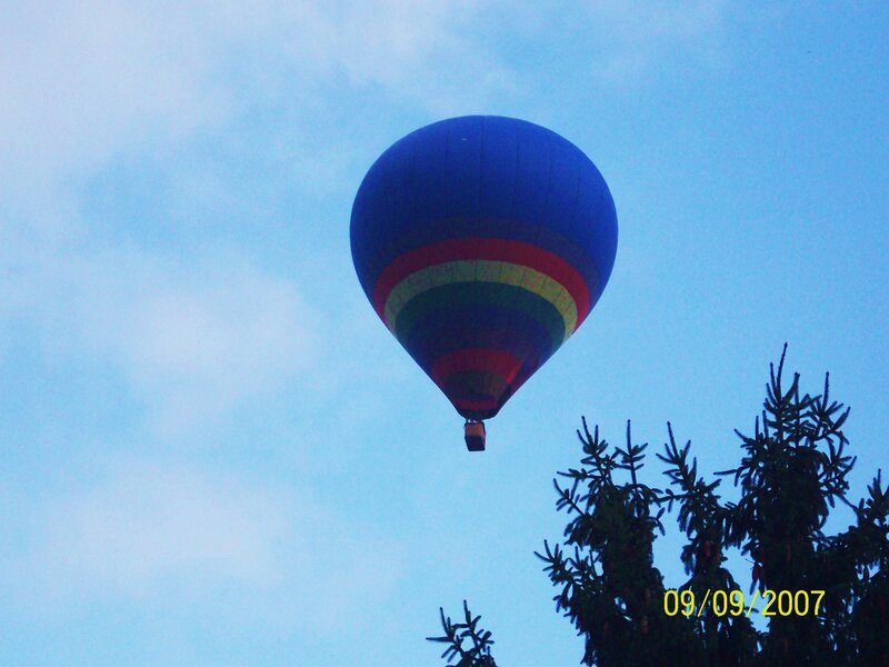 Blue hot air balloon in sky