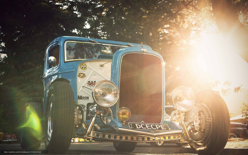 Blue hot rod car at sunset
