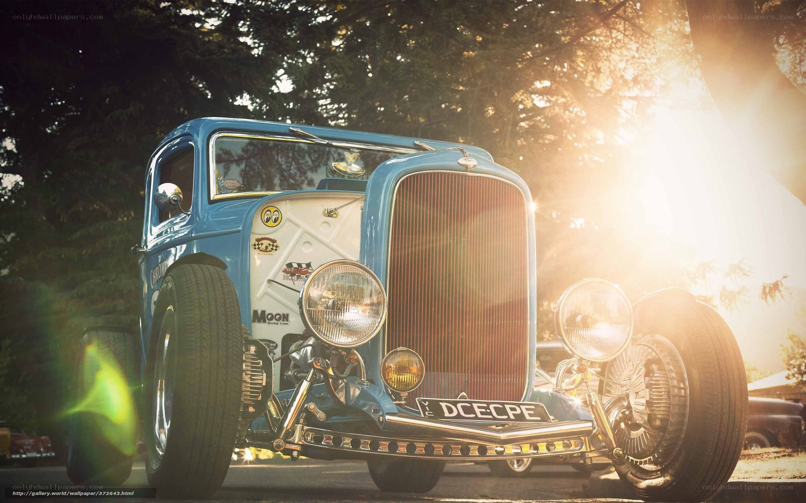 Blue hot rod car at sunset