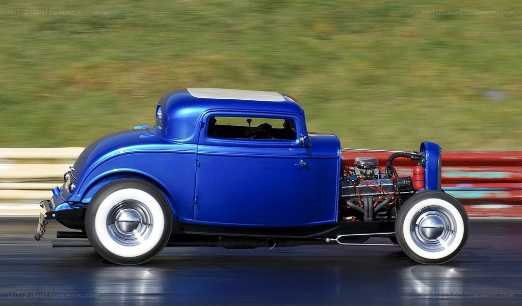 blue hot rod on a racetrack