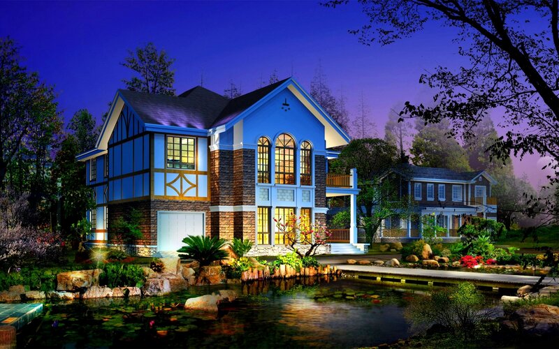 Blue house at night with pond