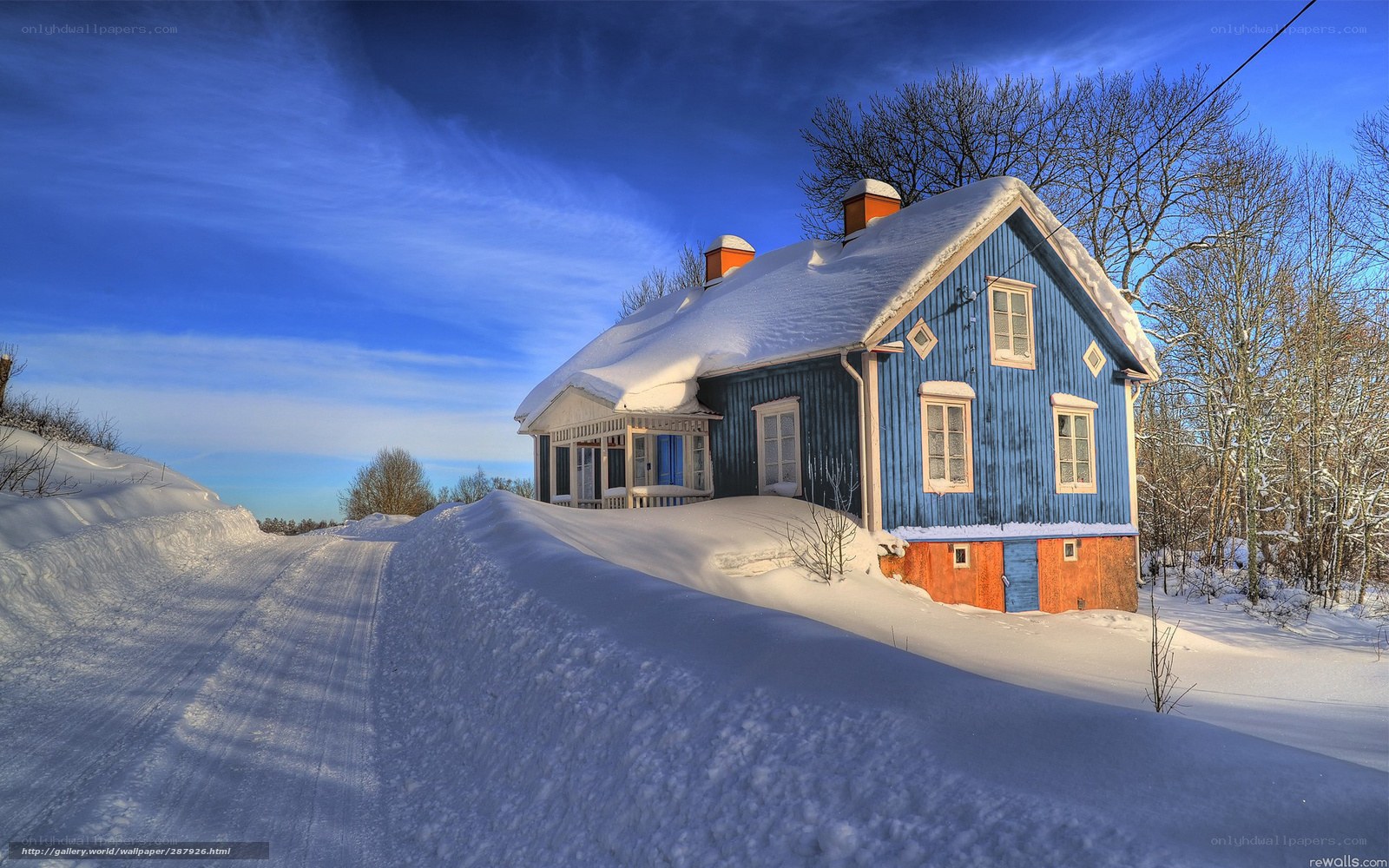 Blue house in winter landscape