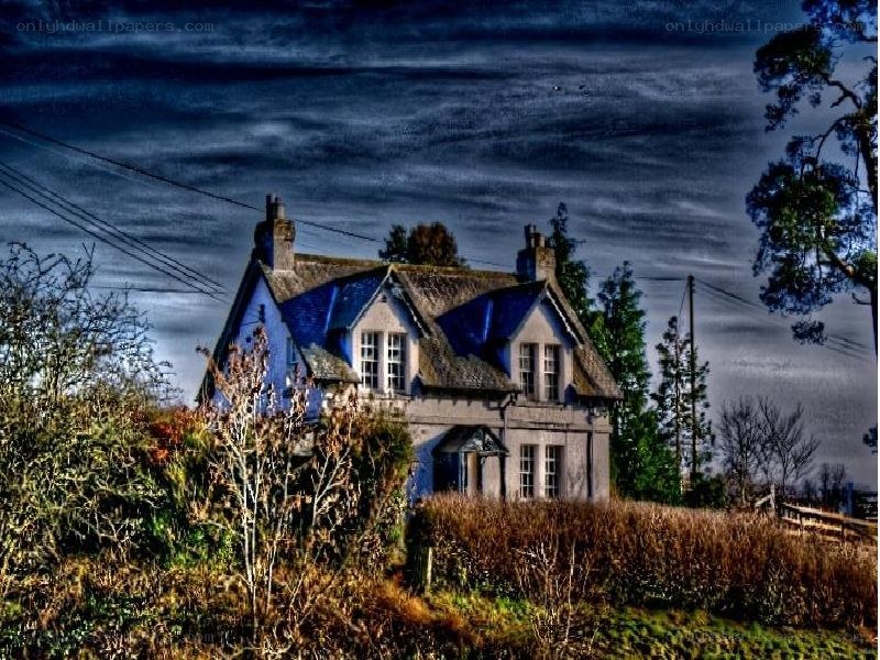 Blue house on a hillside