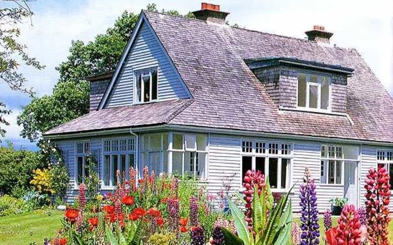 Blue House with Flowers — Serene
