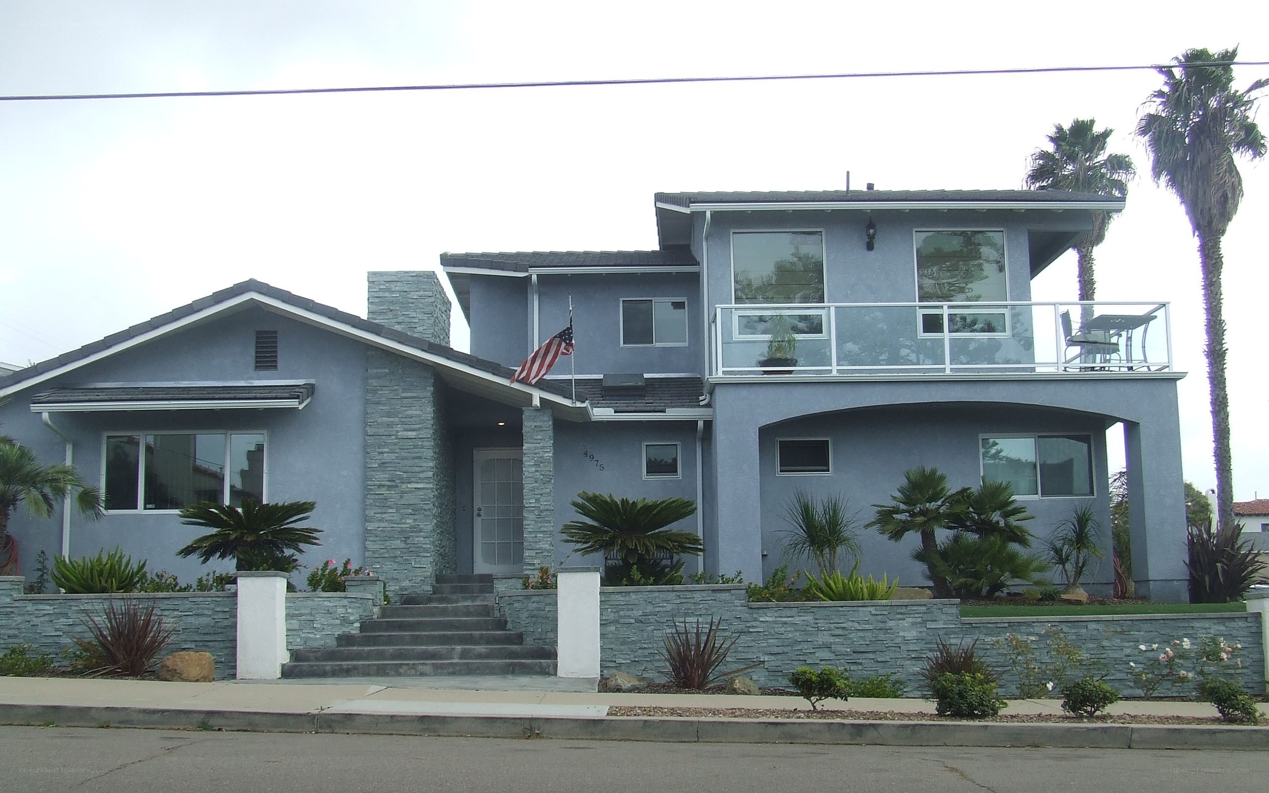 Blue house with palm trees