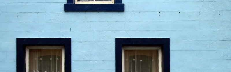 blue house with three windows