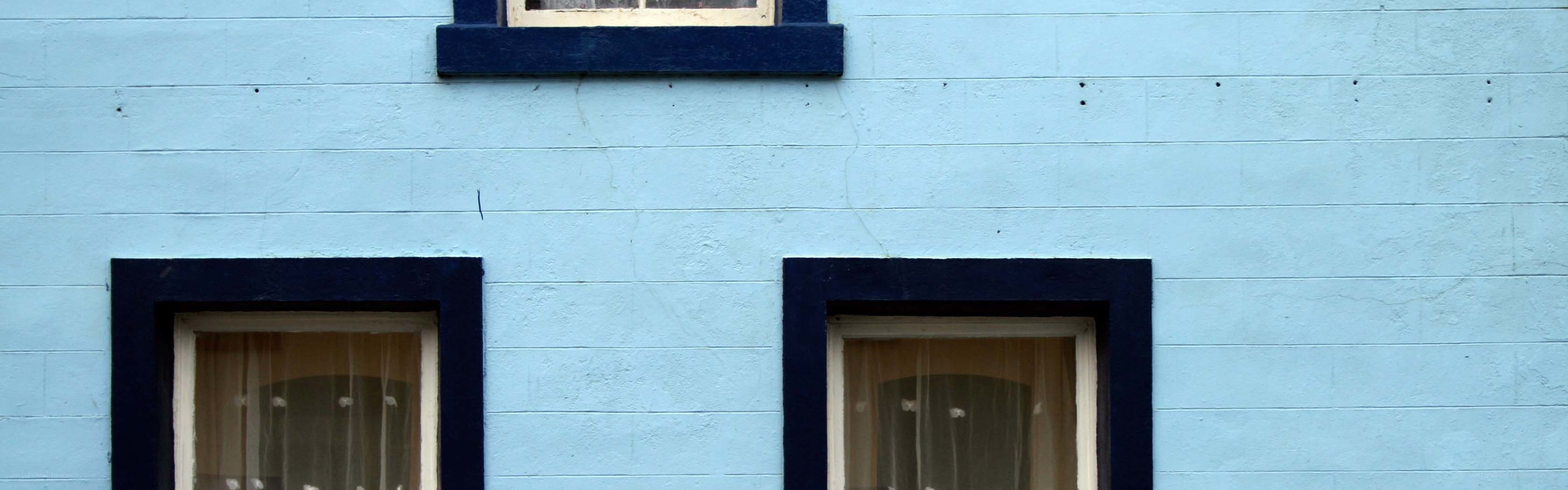 blue house with three windows