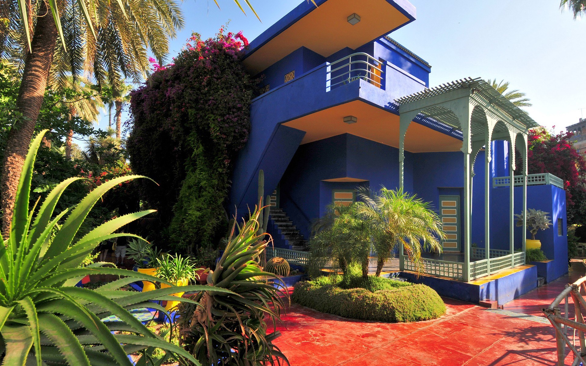 Blue house with tropical garden