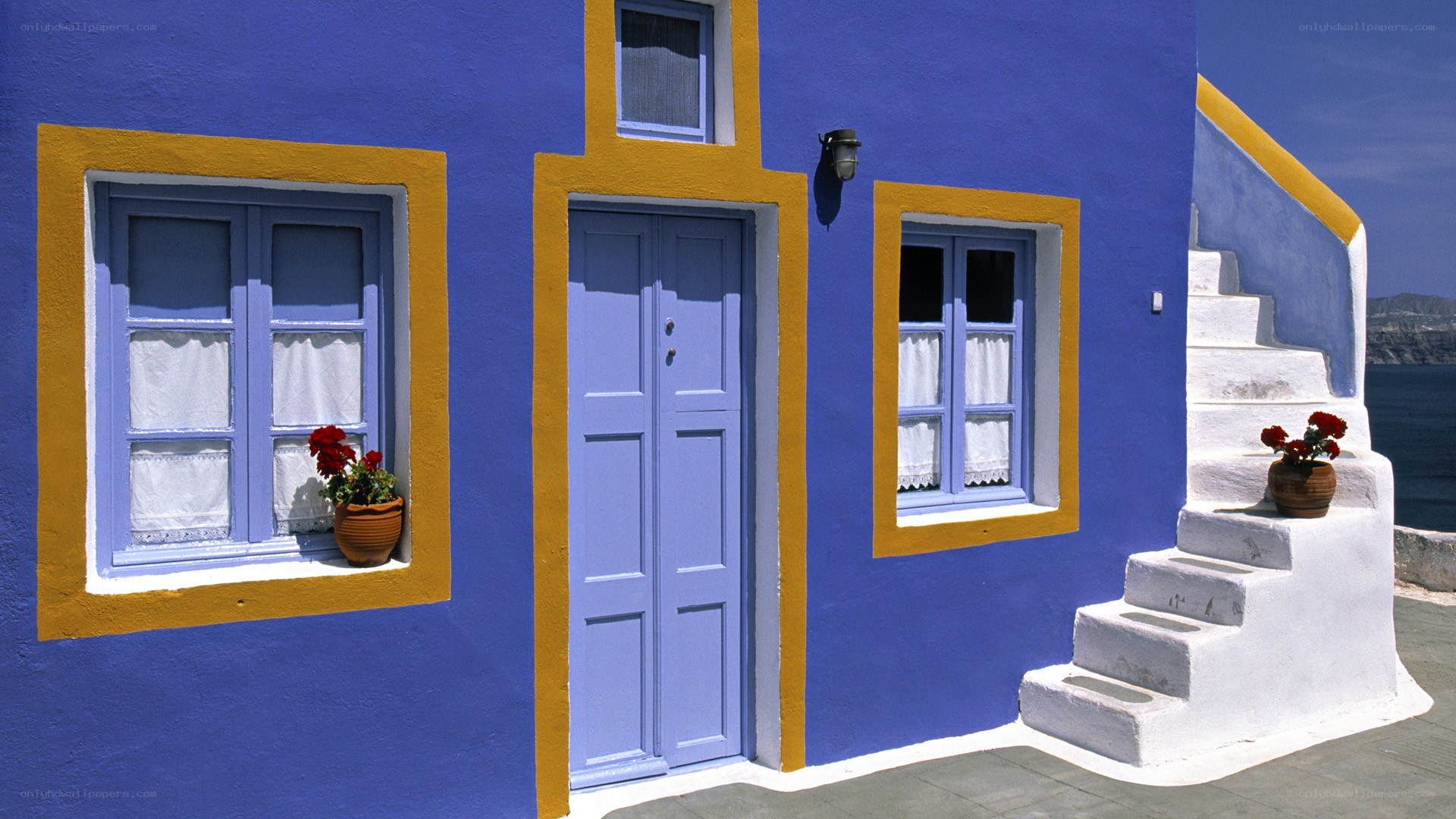 Blue house with white stairs