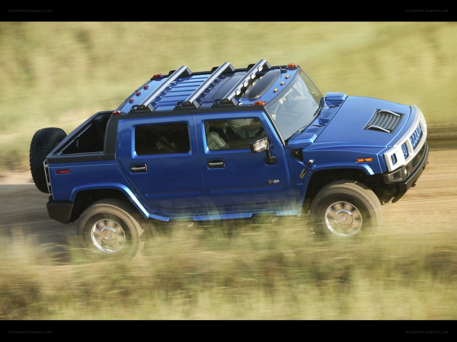 blue hummer h2 in motion