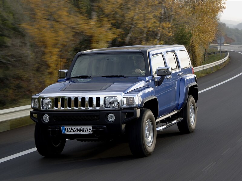 blue hummer h3 on a road