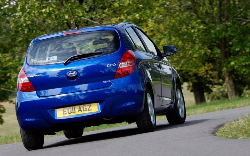 blue hyundai i20 driving on road