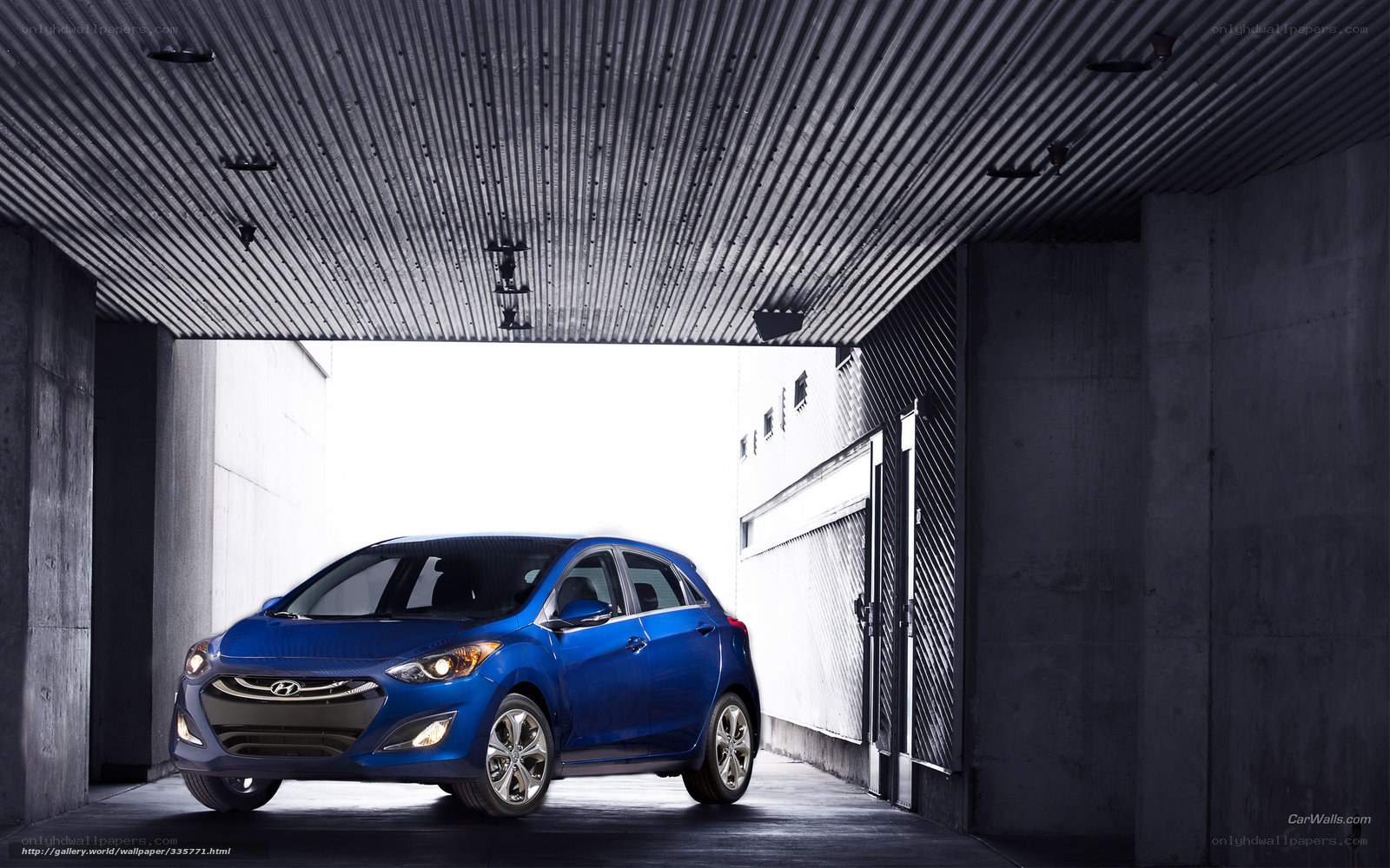 Blue Hyundai i30 in a garage
