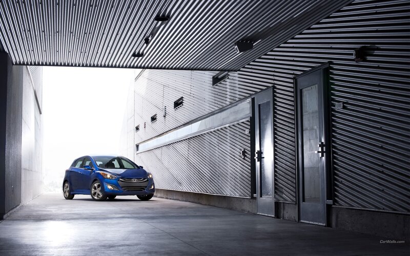 Blue Hyundai i30 in a modern garage