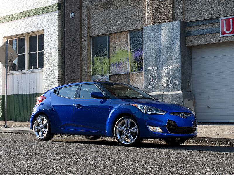 Blue Hyundai Veloster on city street