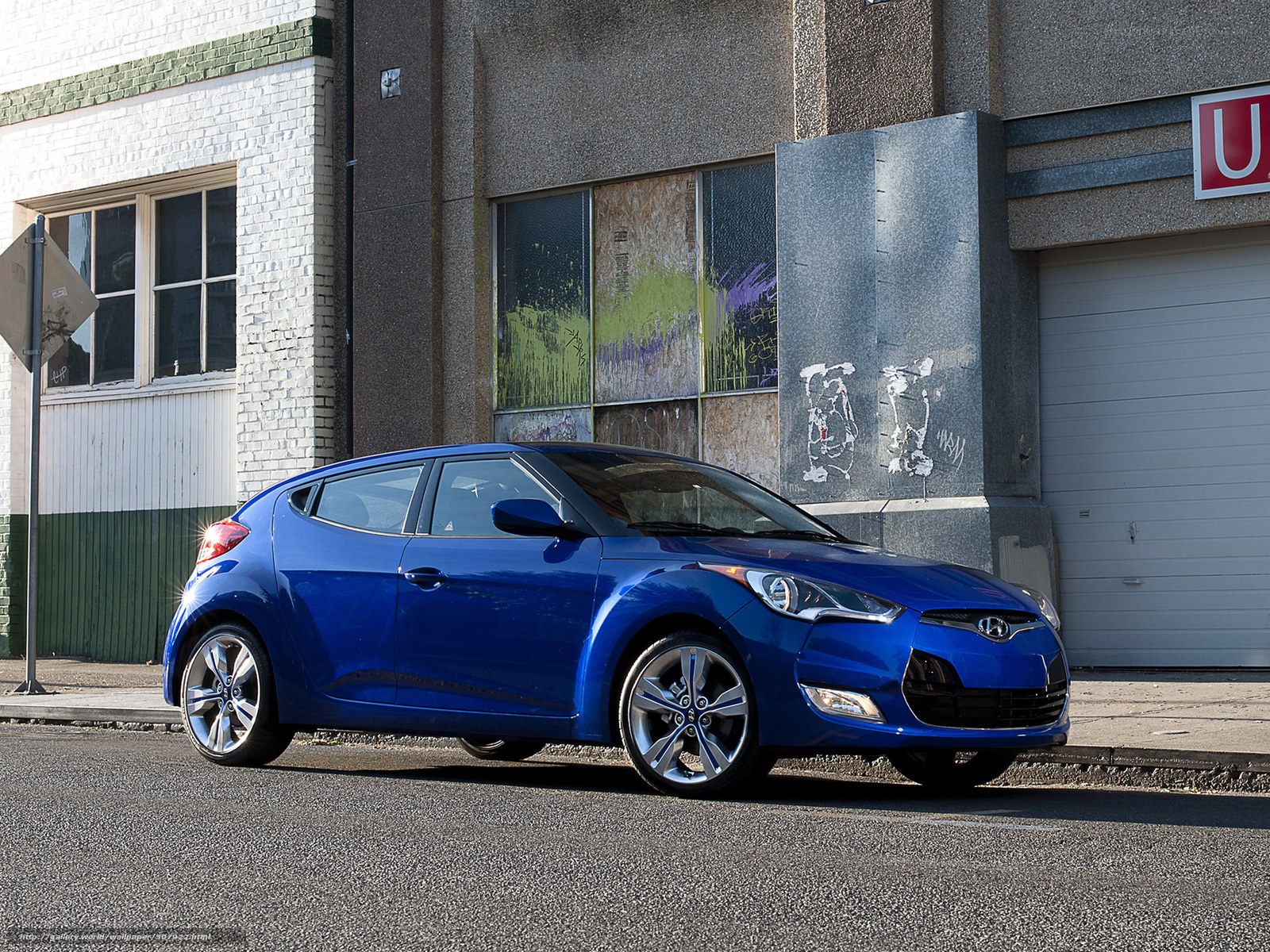 Blue Hyundai Veloster on city street