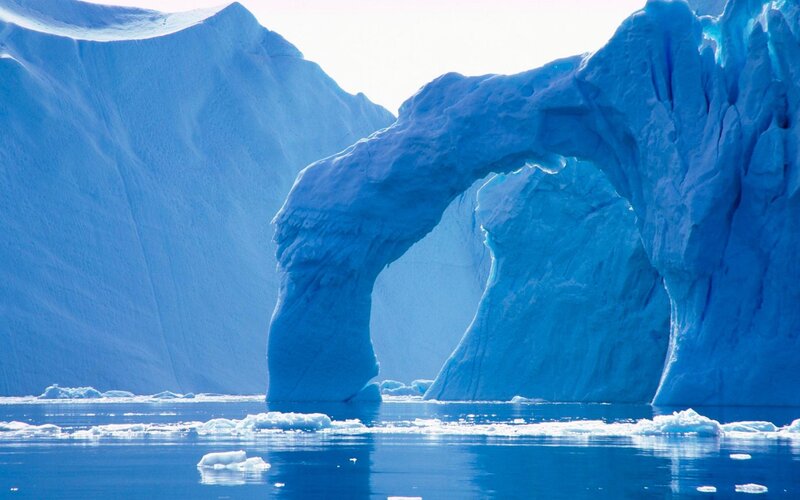 Blue ice arch in arctic waters