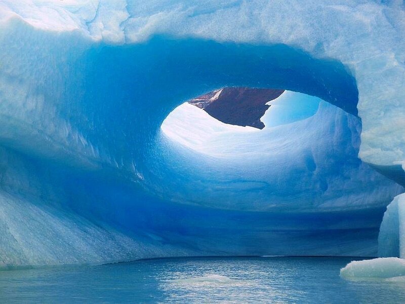 Blue ice arch in glacier