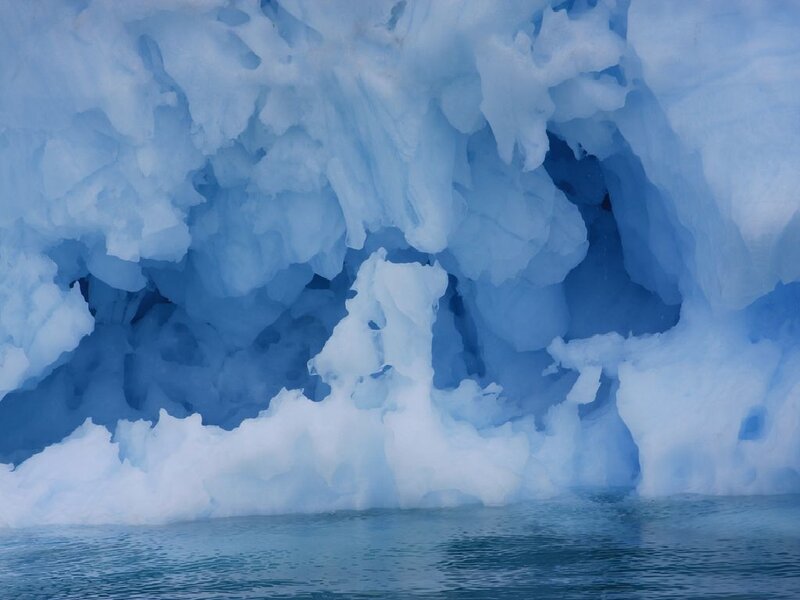blue ice cave in water