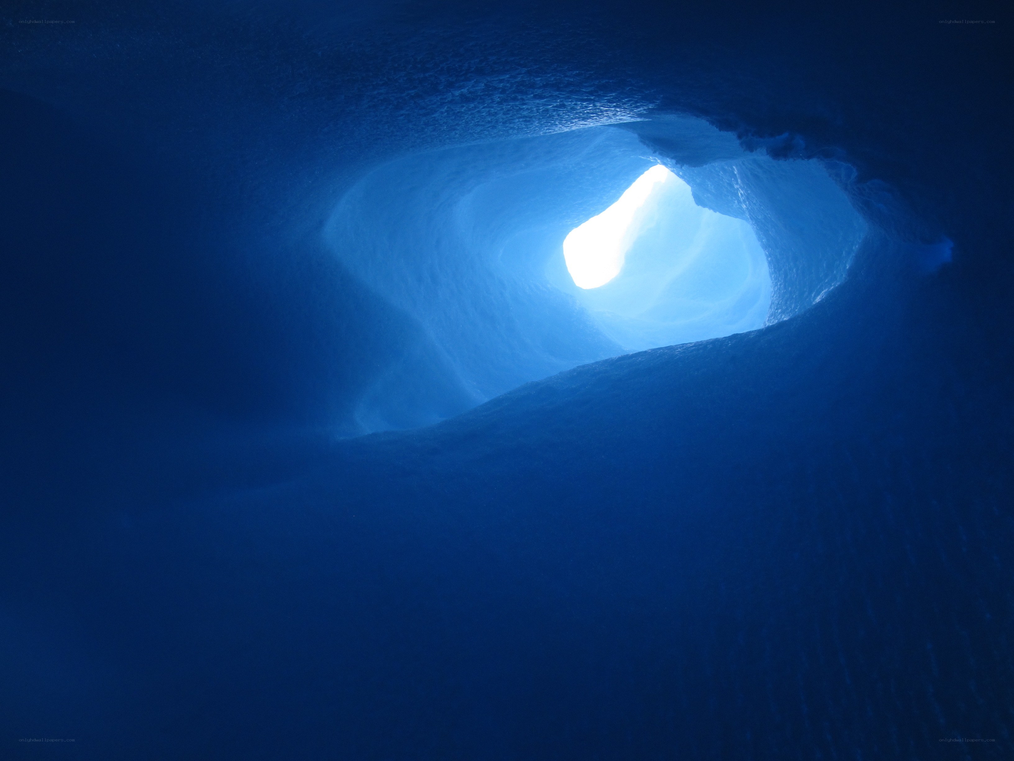 Blue ice cave tunnel