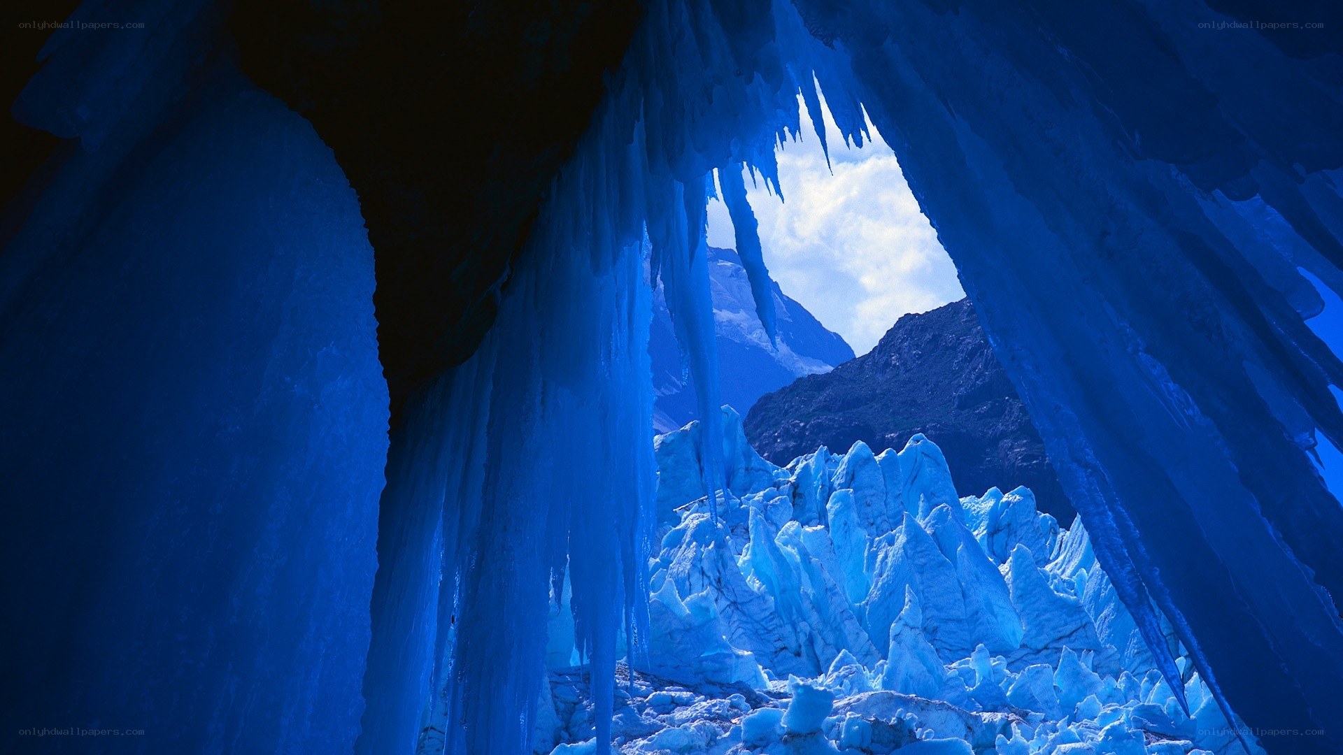 Blue ice cave with glacier view