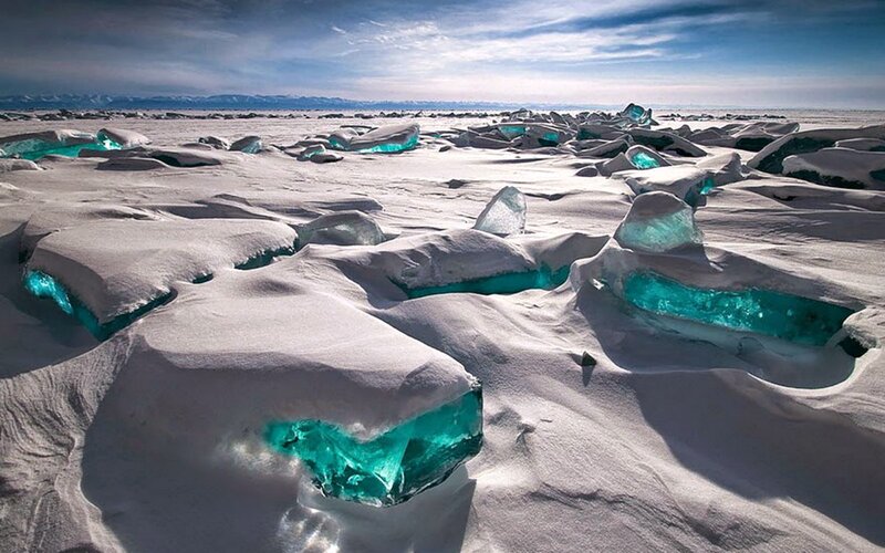 Blue Ice Chunks in Snow