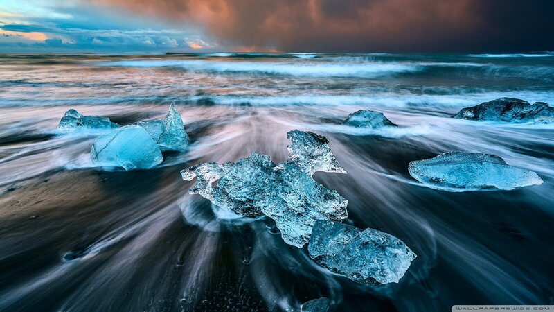 Blue Ice Chunks on Beach — Dramatic