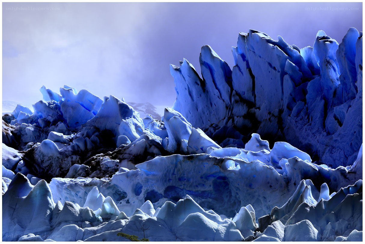 Blue ice formations on a glacier