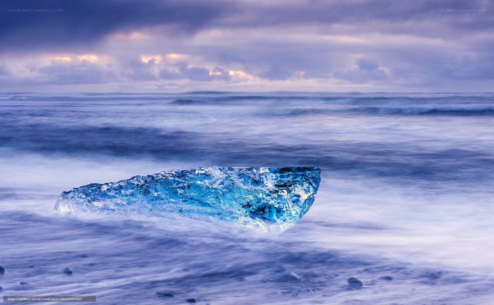 Blue ice on a stormy beach