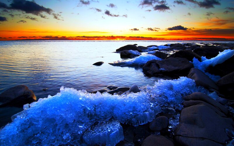 Blue Ice on Rocky Shore