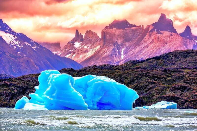 Blue Iceberg in Water — Dramatic, Sunset, Photograph