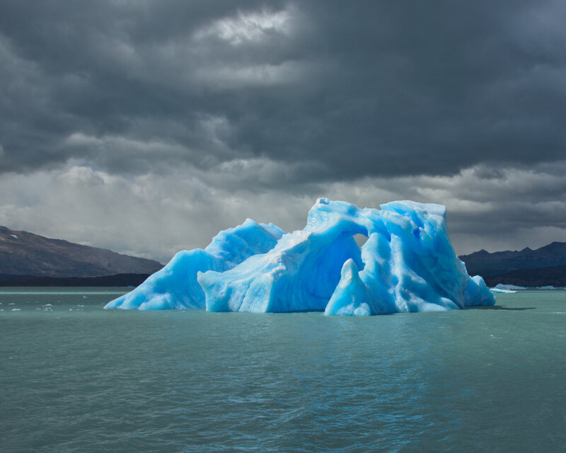 Blue Iceberg in Water — Dramatic