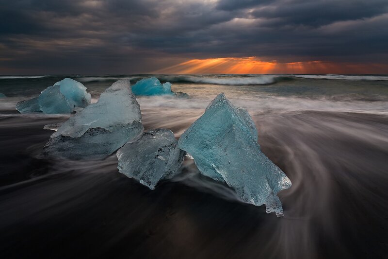Blue Icebergs on Beach — Dramatic
