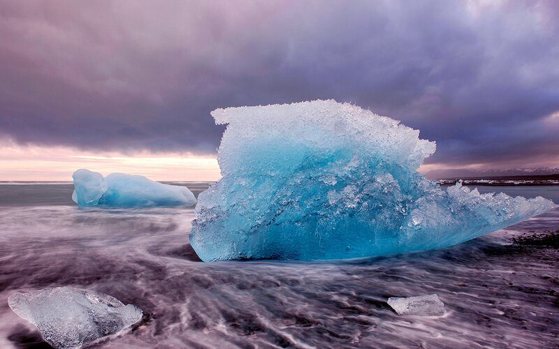 Blue Icebergs on Beach