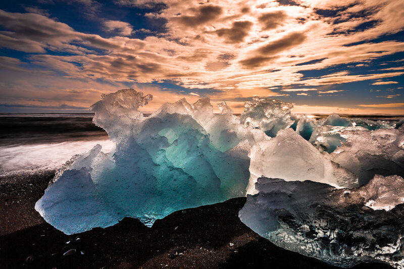 Blue Icebergs on Black Sand