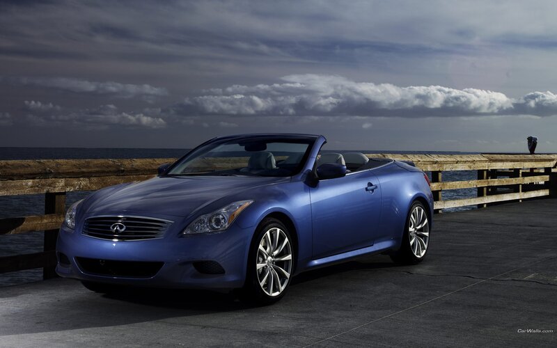blue infiniti convertible on pier