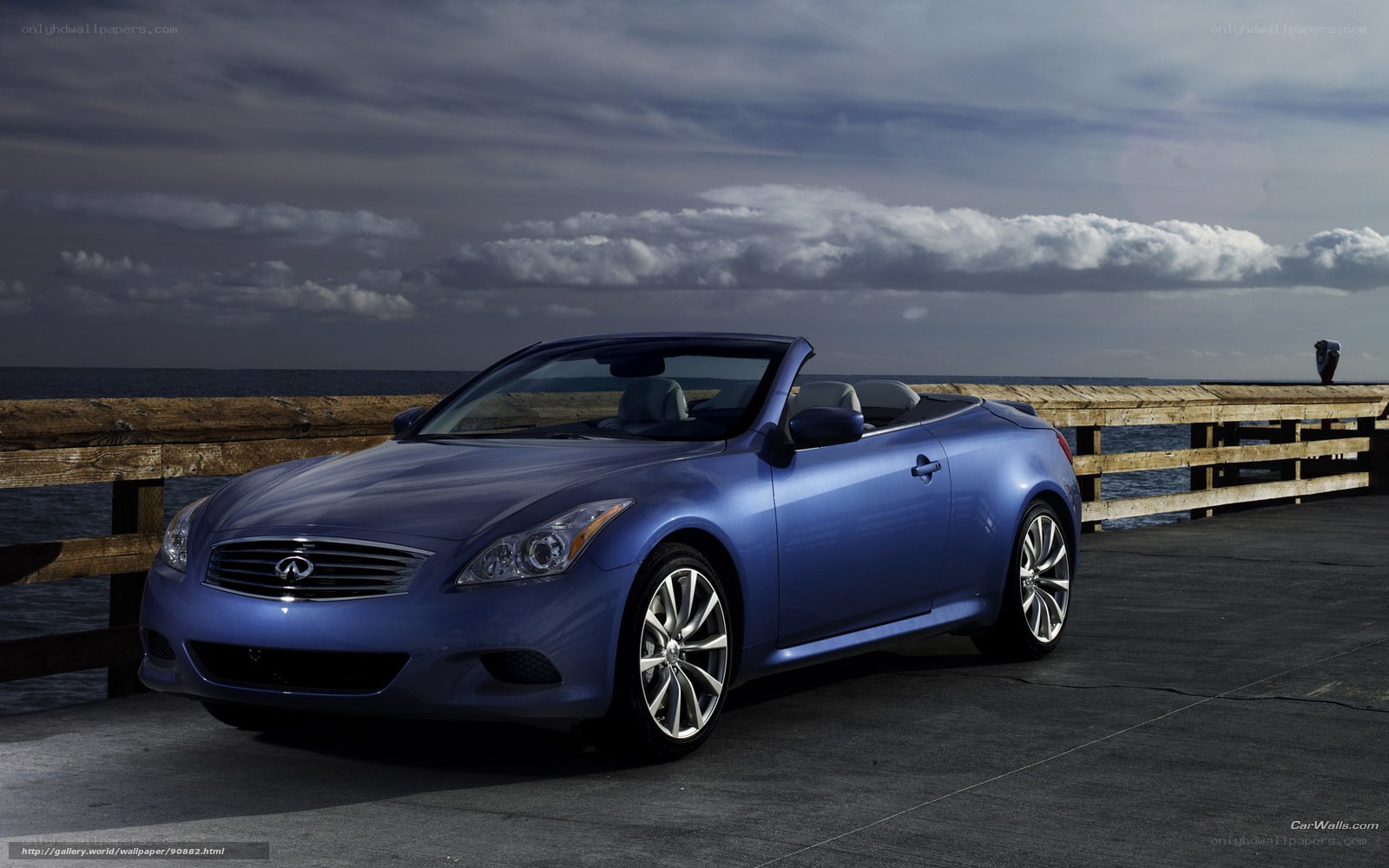 blue infiniti convertible on pier