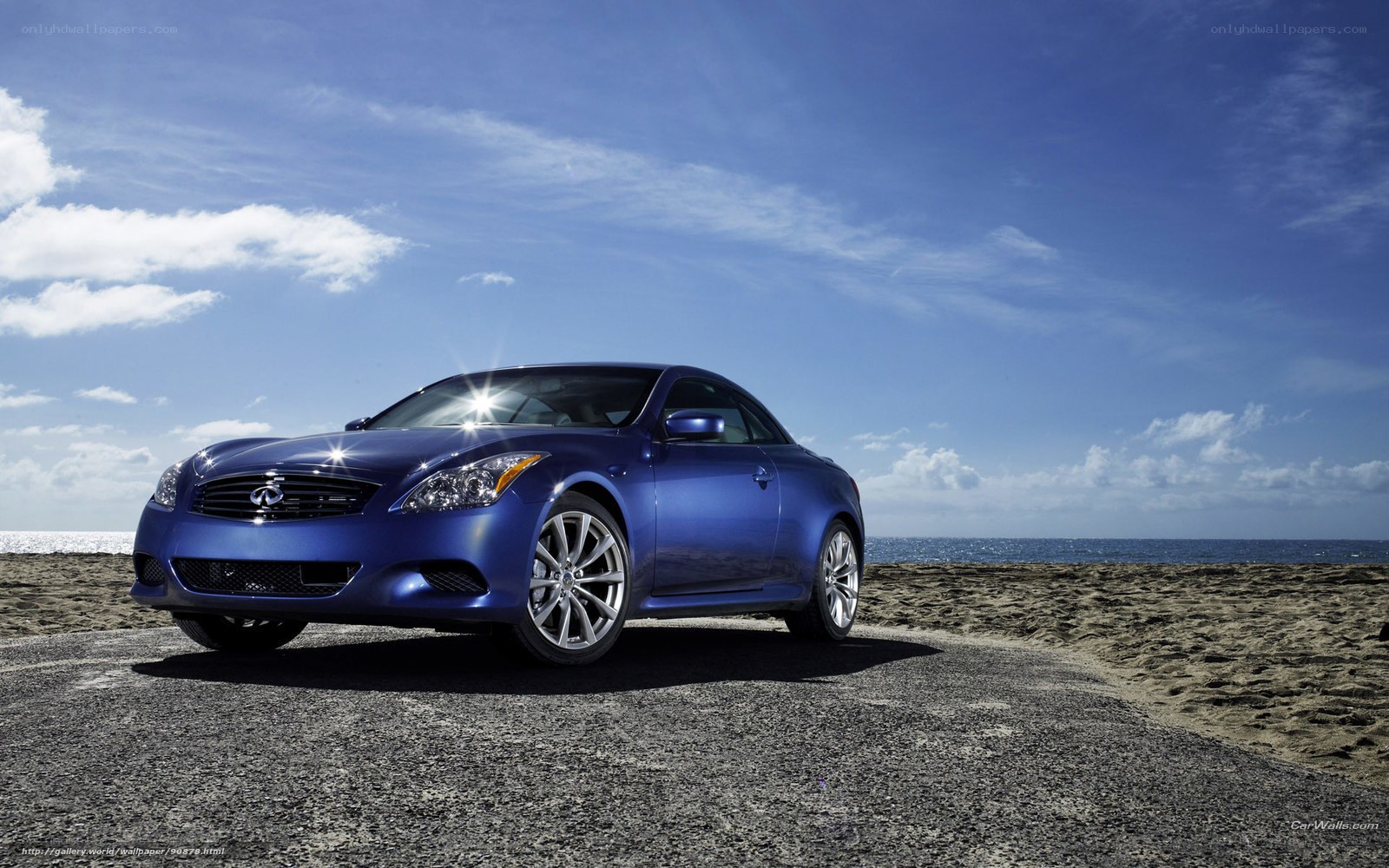 Blue Infiniti G37 Coupe on beach