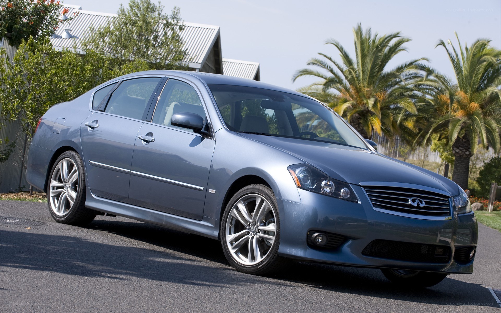blue infiniti sedan parked outside