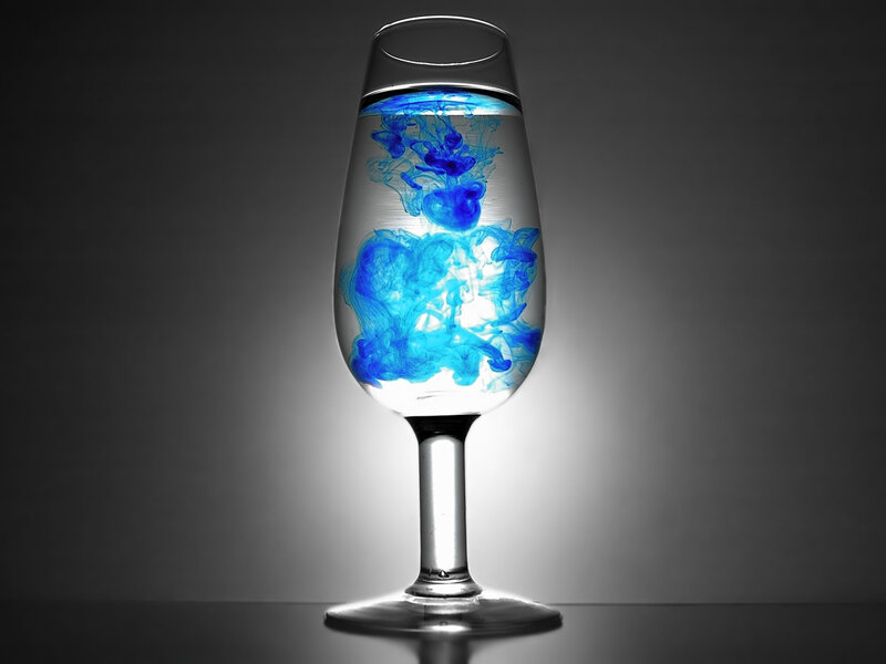 blue ink in wine glass