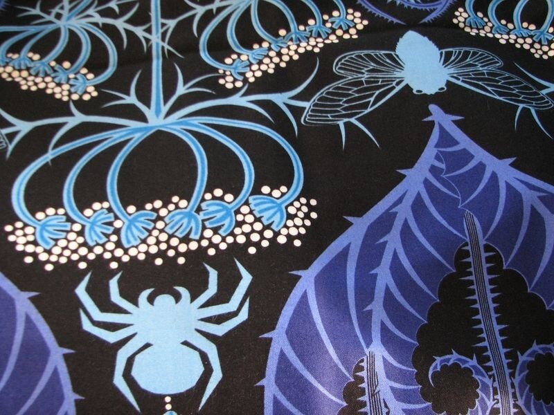 Blue Insects on Black Fabric