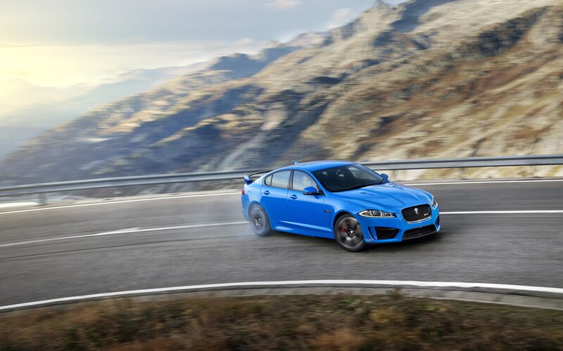Blue Jaguar Car — Dynamic, Afternoon, Photograph, Mountain, Road, Guardrail
