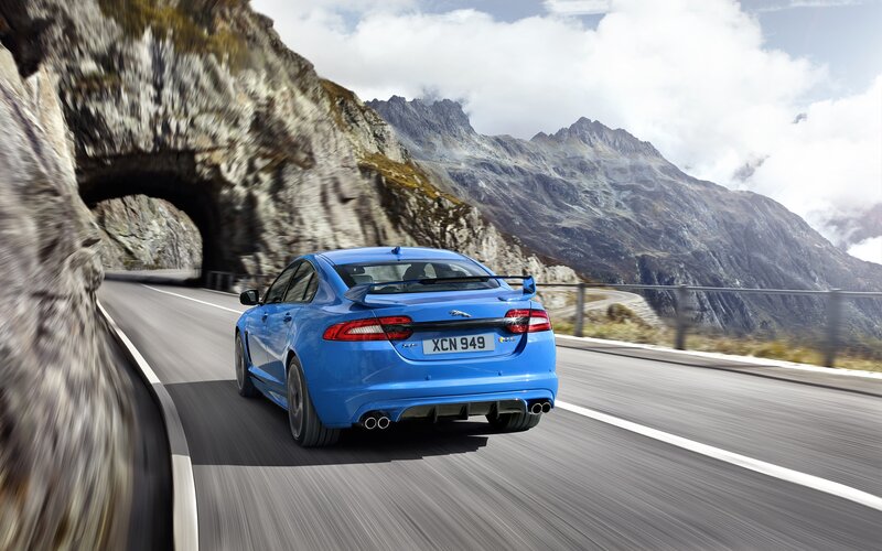 Blue Jaguar Car — Dynamic, Afternoon, Photograph, Mountain Road, Tunnel