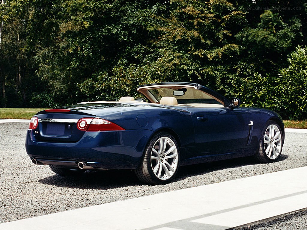 Blue Jaguar convertible parked